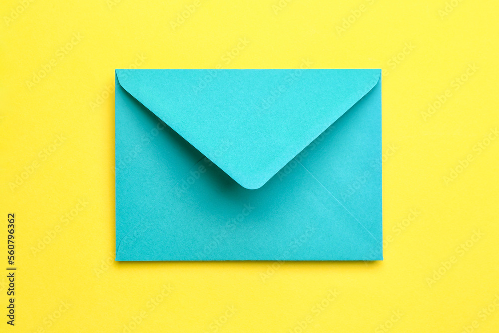 Paper envelope on yellow background