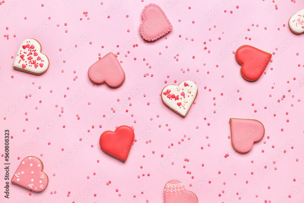 Composition with tasty heart shaped cookies and colorful sprinkles on pink background. Valentines D