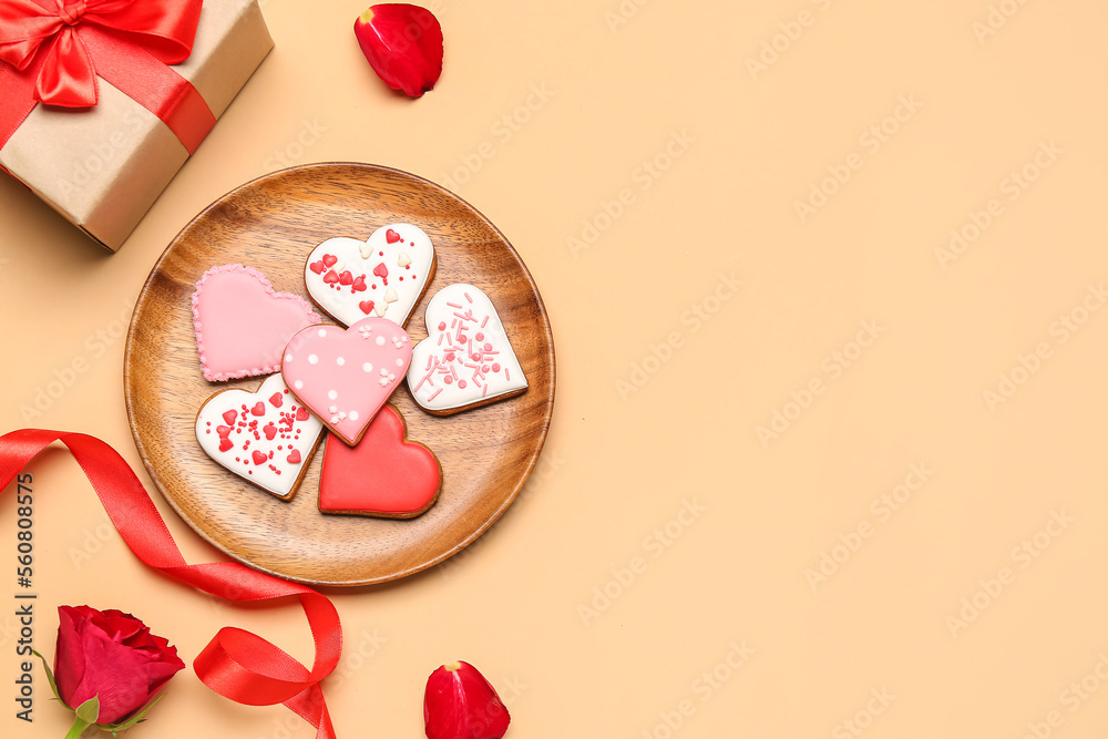 Composition with tasty heart shaped cookies, gift box and rose on color background. Valentines Day 