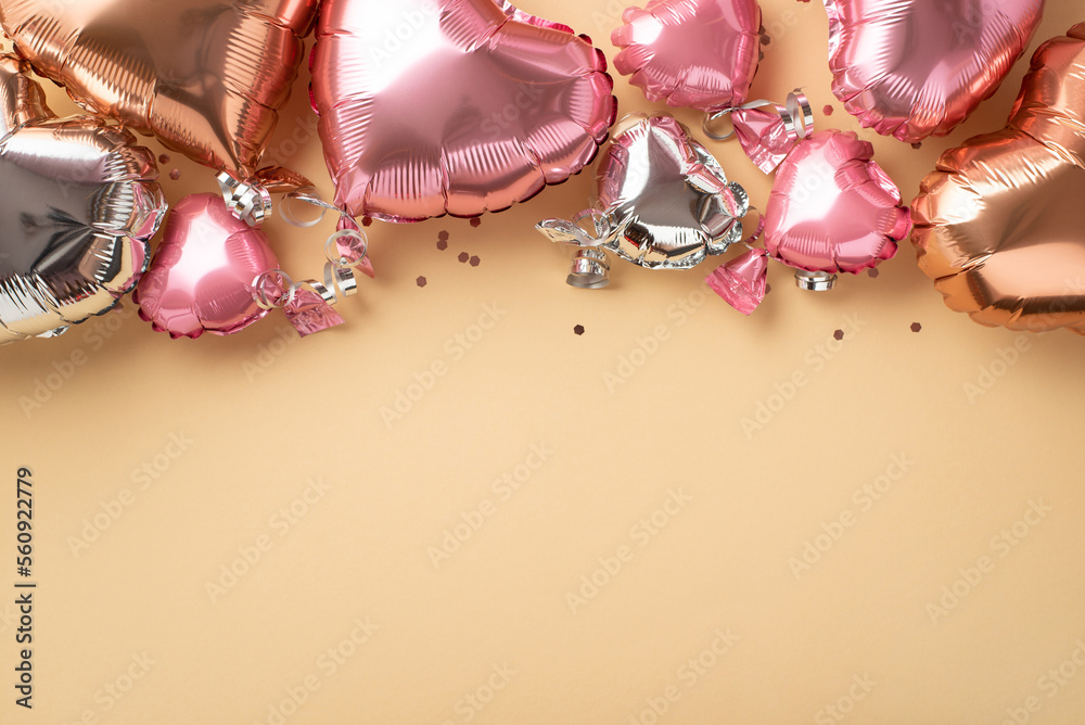 Top view photo of Valentines Day decorations heart shaped pink silver golden balloons and sequins o