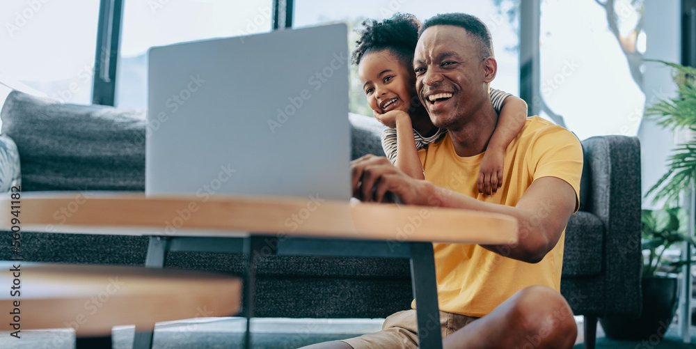 Dad and daughter watch an interesting video on a kids channel online. Happy father in his 30s spendi