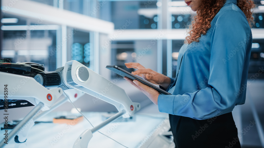 Close Up Footage of a Woman Using Tablet Computer in High Tech Modern Industrial Office Facility. En