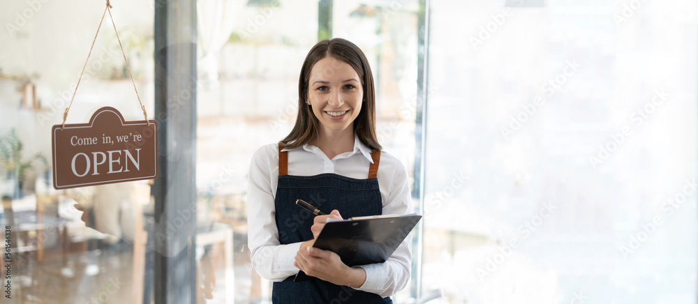 Opening a small business, Happy woman in an apron standing near a bar counter coffee shop, Small bus