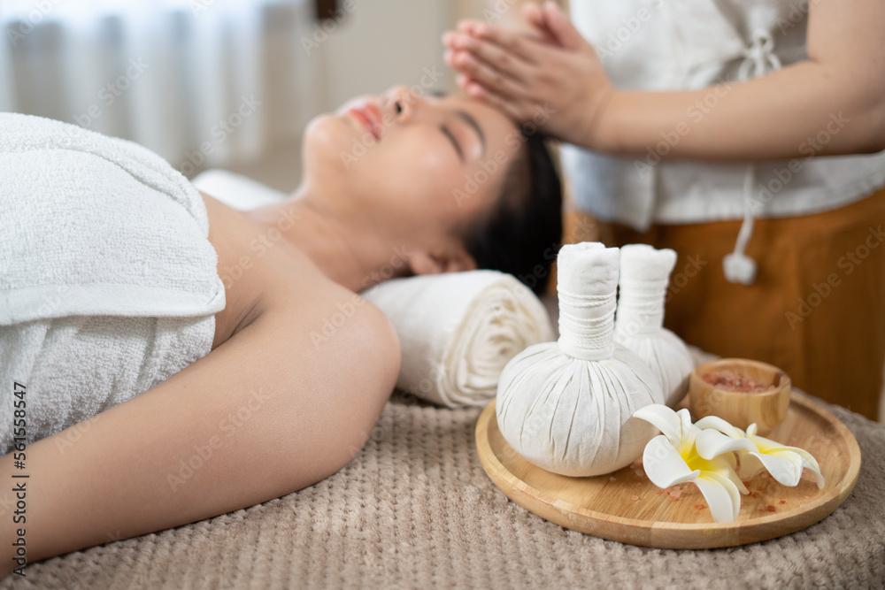 Young Asian beauty woman enjoying massage and spa.