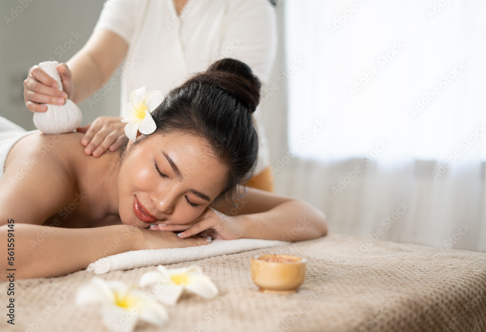 Young Asian beauty woman enjoying massage and spa.