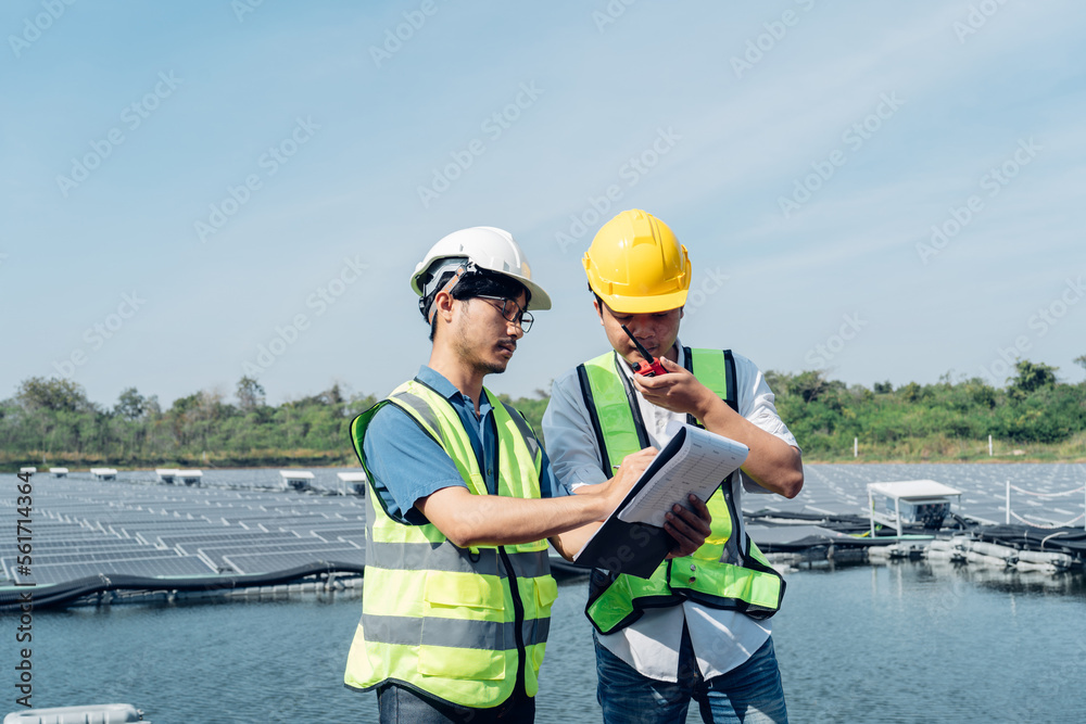 Team of engineers wearing a uniform inspect and check solar cell panel, solar cell is smart ecology 