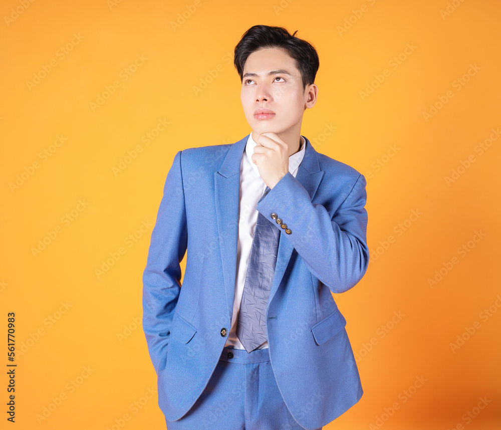 Photo of young Asian business man on background