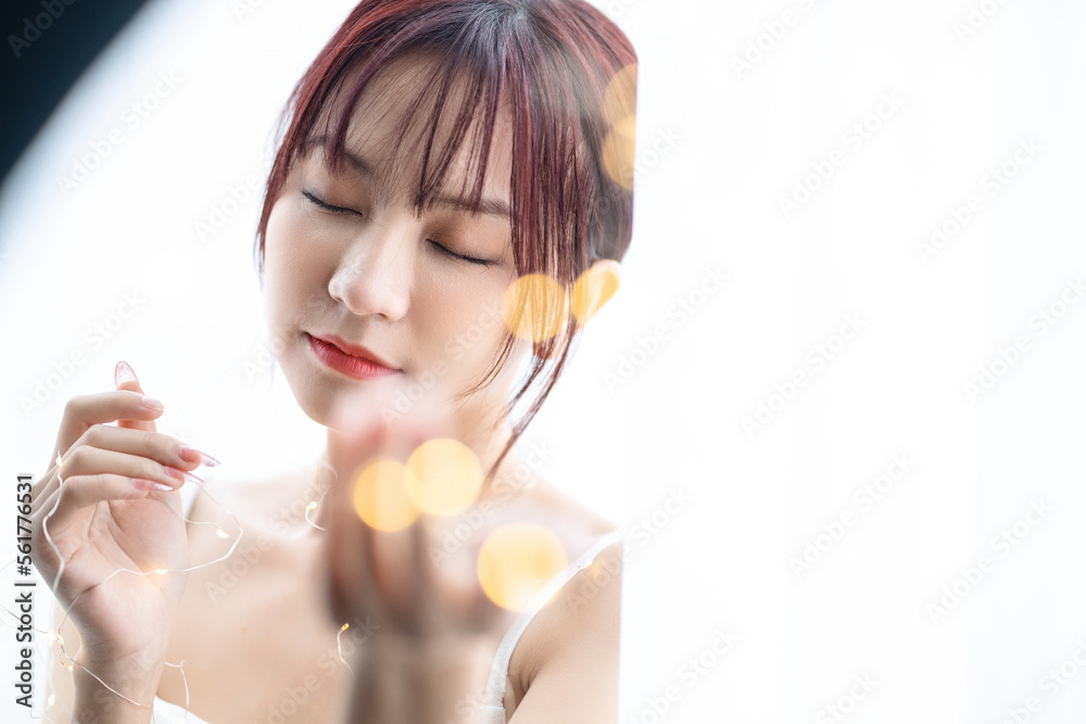 Beauty image of young Asian woman at home in the morning