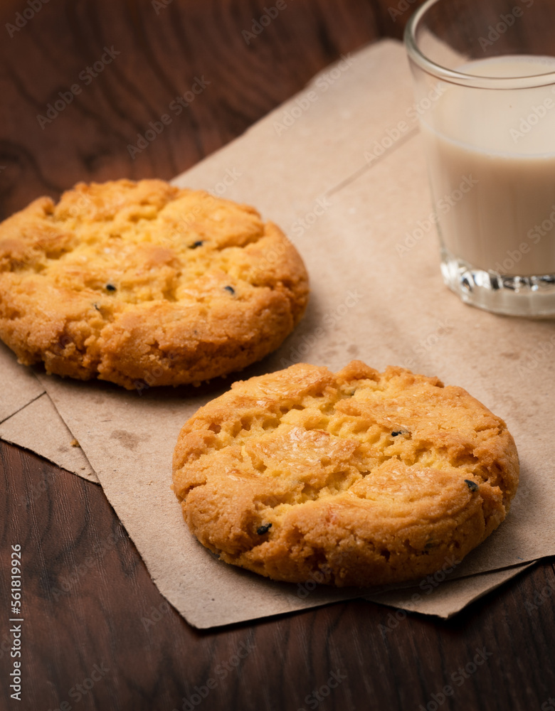 Closeup delicious Hong Kong butter cookie recipes on papers and wooden table.