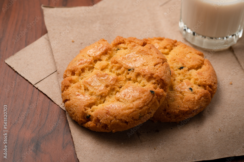 Closeup delicious Hong Kong butter cookie recipes on papers and wooden table.