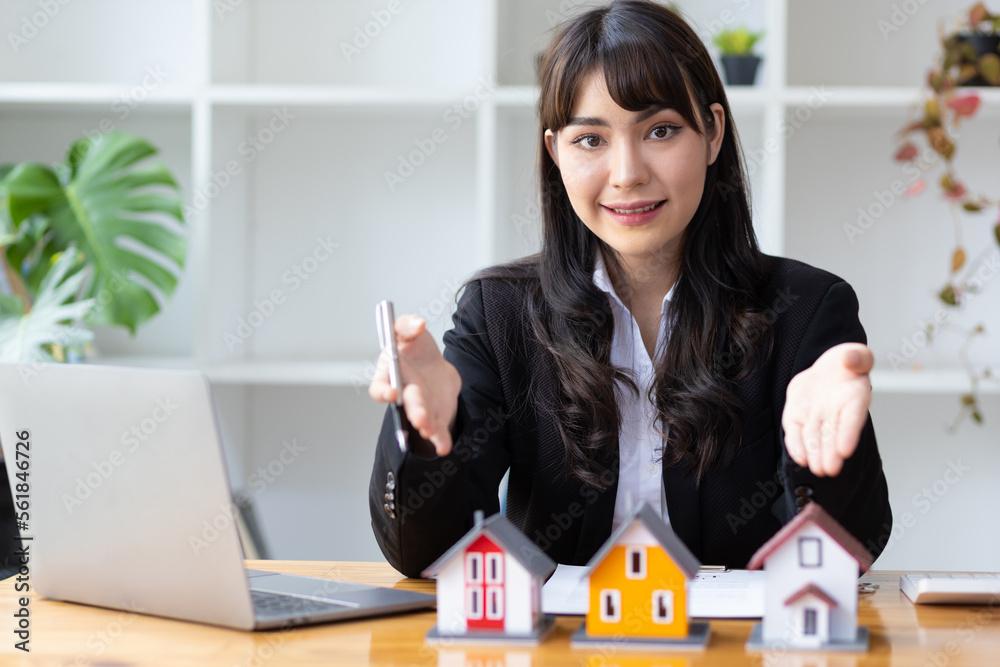 Real estate agent is showing a model home, The concept of buying and selling homes and rental homes.