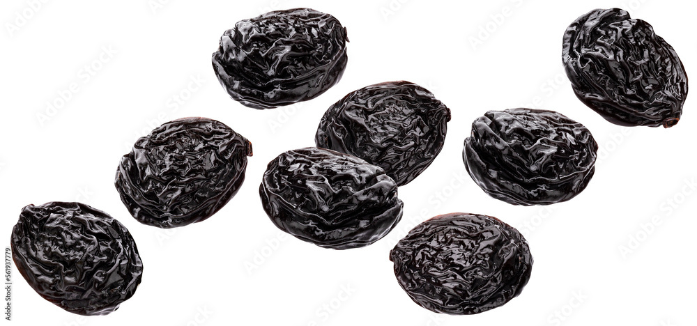 Falling prunes isolated on white background