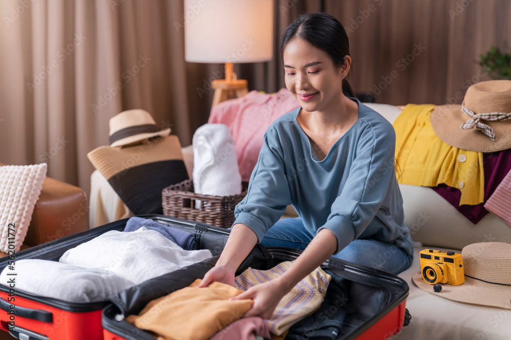 asian young mature adult female woman ready to travel, asian female wear casual cloth arrange packin