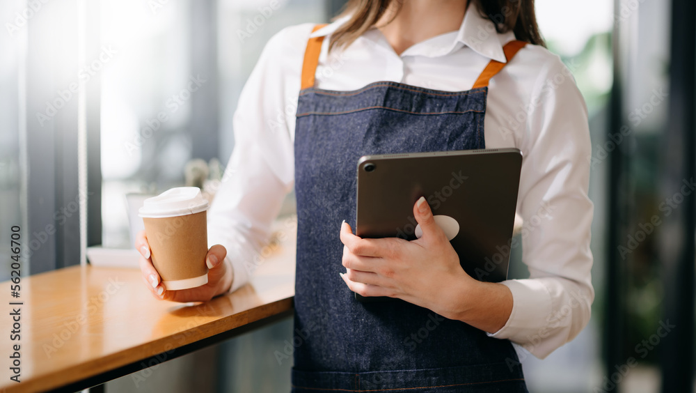 Coffee Business Concept Beautiful lady smiling at camera offers disposable take away hot coffee at t