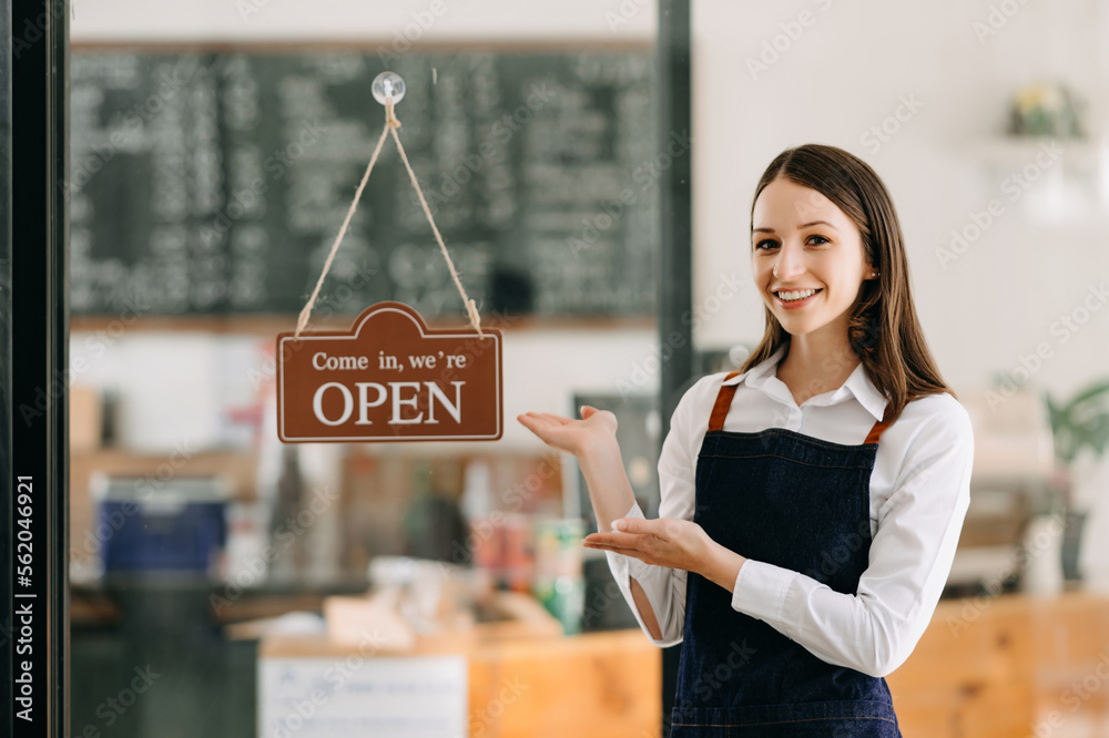 Startup successful small business owner sme woman stand with tablet  in cafe restaurant. woman baris