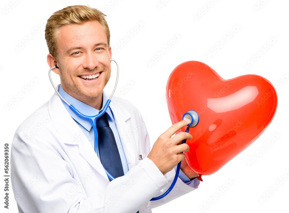 A handsome young doctor standing alone in the studio and using a stethoscope on a balloon heart isol