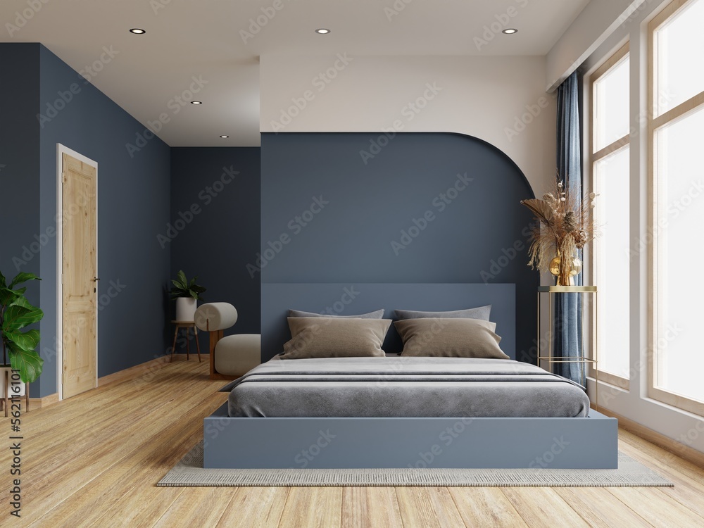 Dark bed and mockup dark blue wall in bedroom interior.