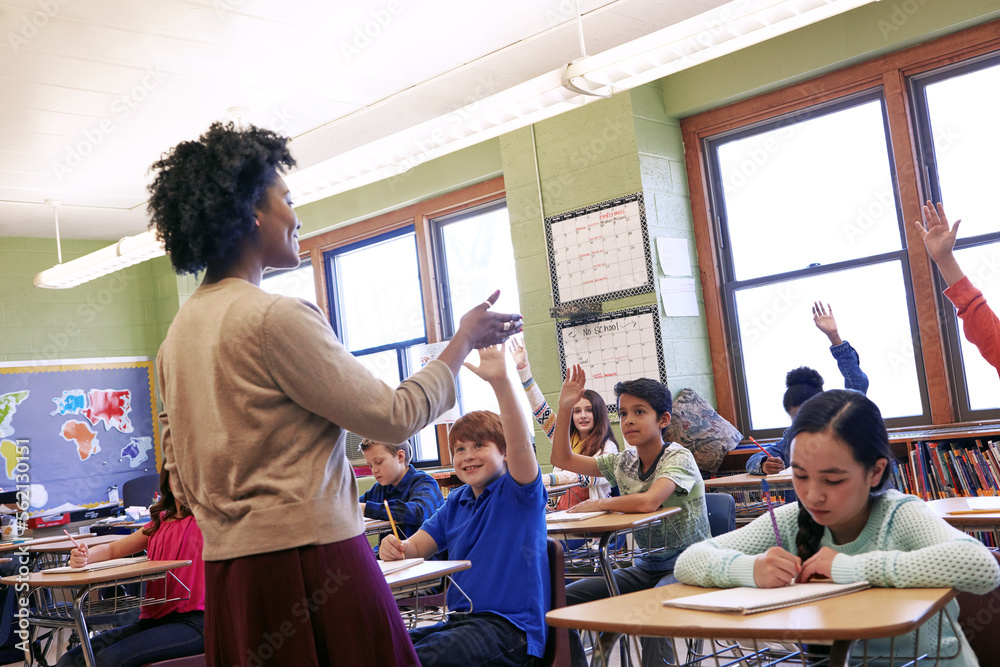 Teacher, students and classroom with hands for question, answer or FAQ of engaging children. Happy f