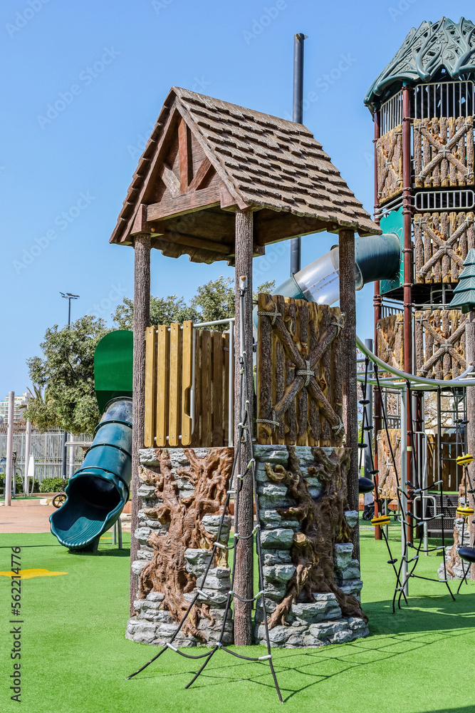 View of childrens complex with climbing net on playground