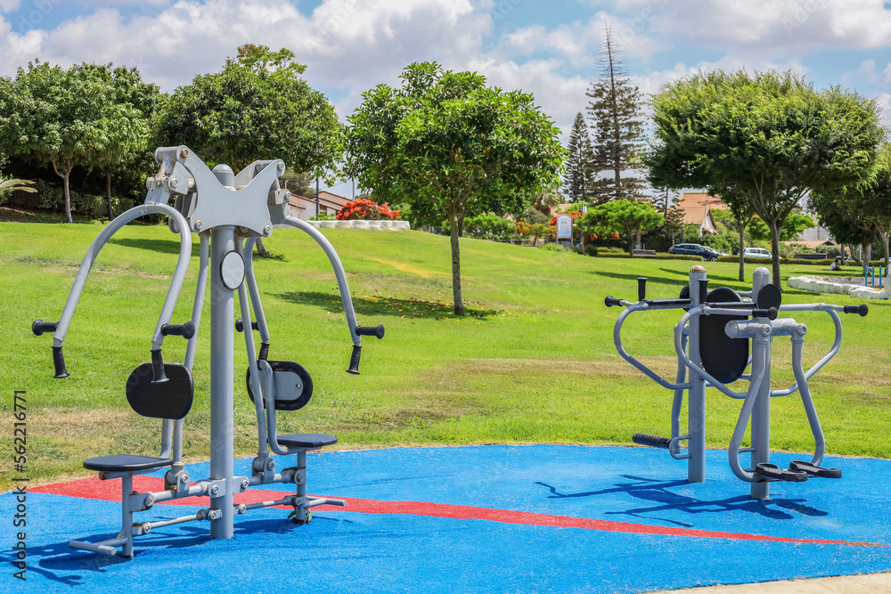 Modern exercise equipment on sport ground in city