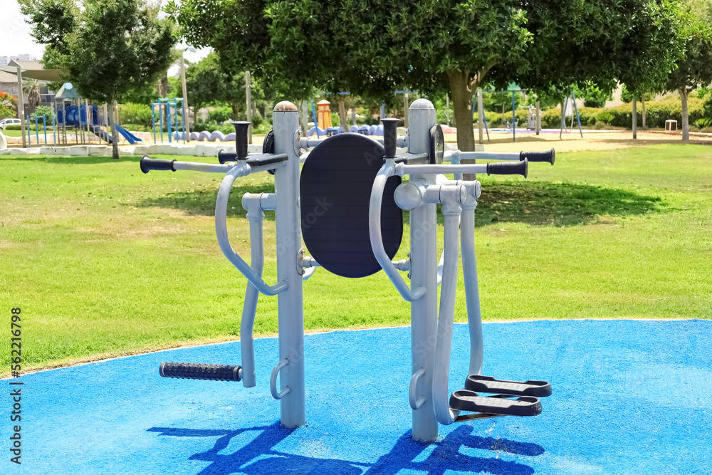 Modern exercise equipment on sport ground in city