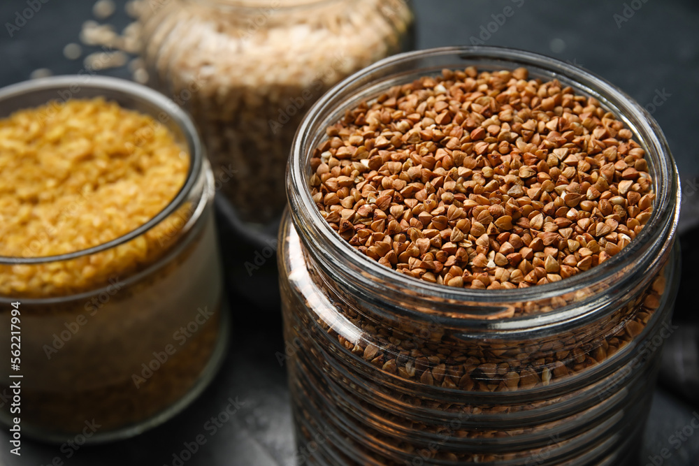 Jar with buckwheat grains, closeup