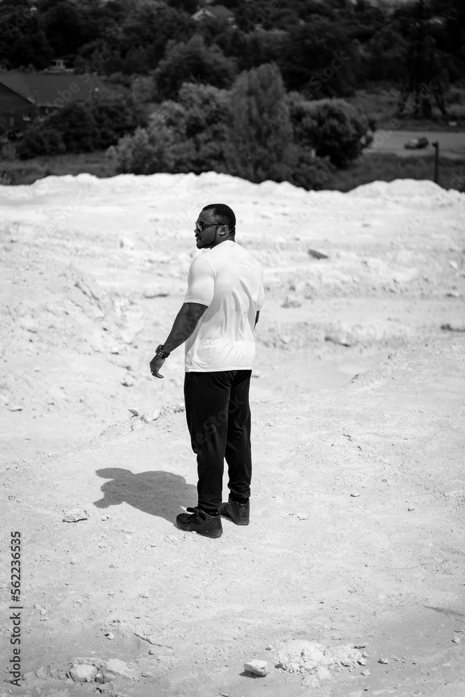 Summer looking person outside. Young handsome black man outdoor.