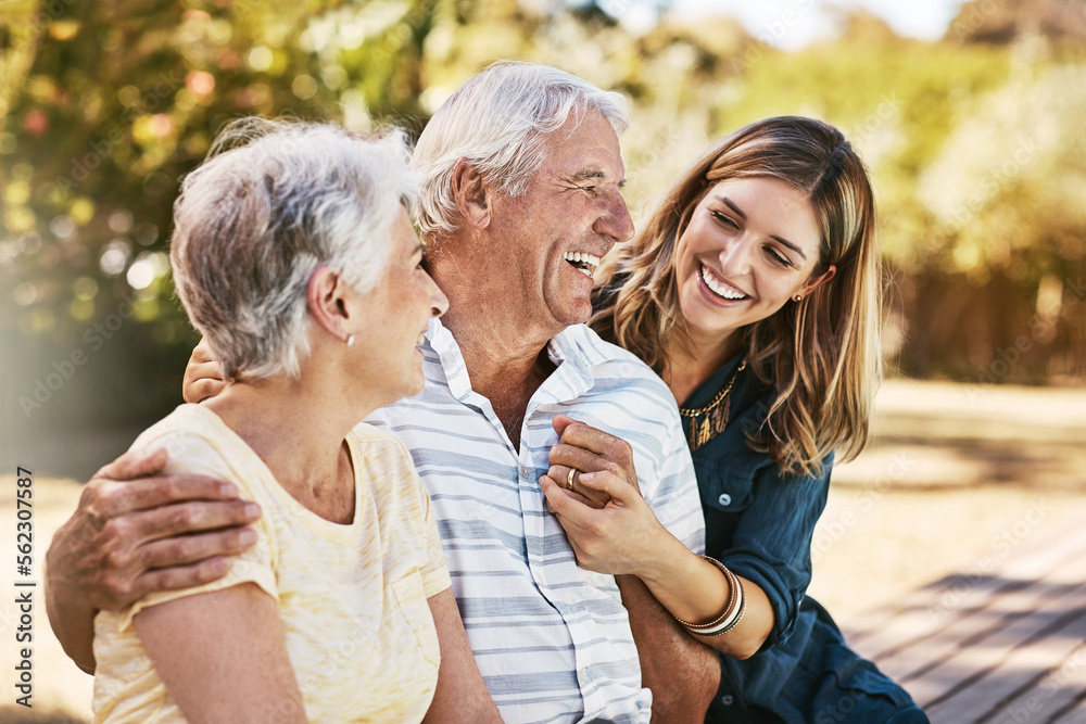 Family, senior parents and woman holding with care, love and hug bonding outdoor in a park. Smile, h