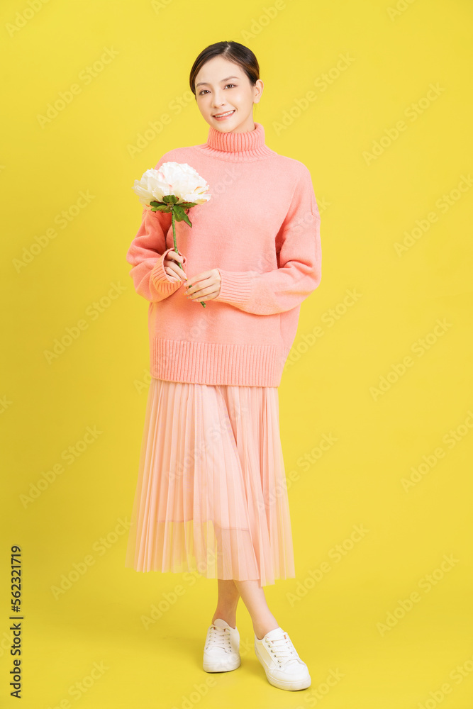 Photo of young Asian girl with flower