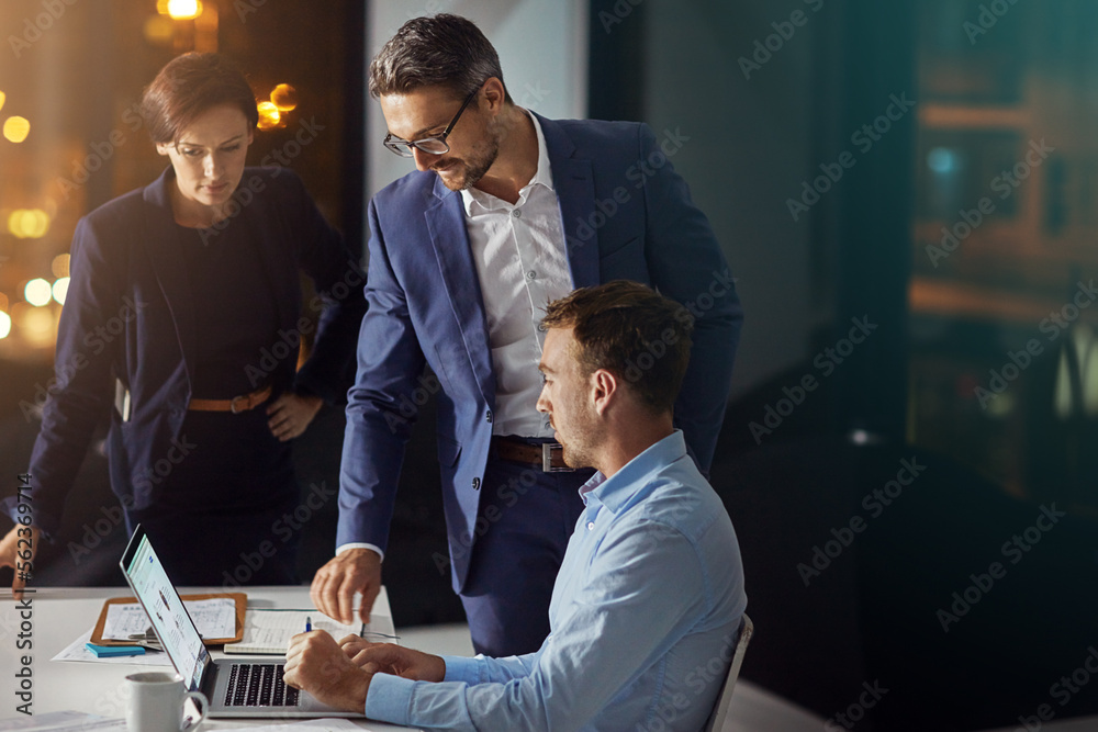 Business people, laptop and meeting working at night in office for big data collaboration, planning 