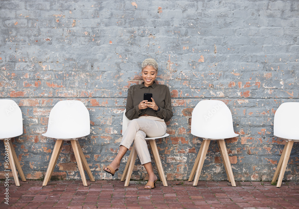 Recruitment, job search and woman on brick wall sitting in line with phone for opportunity, hr email