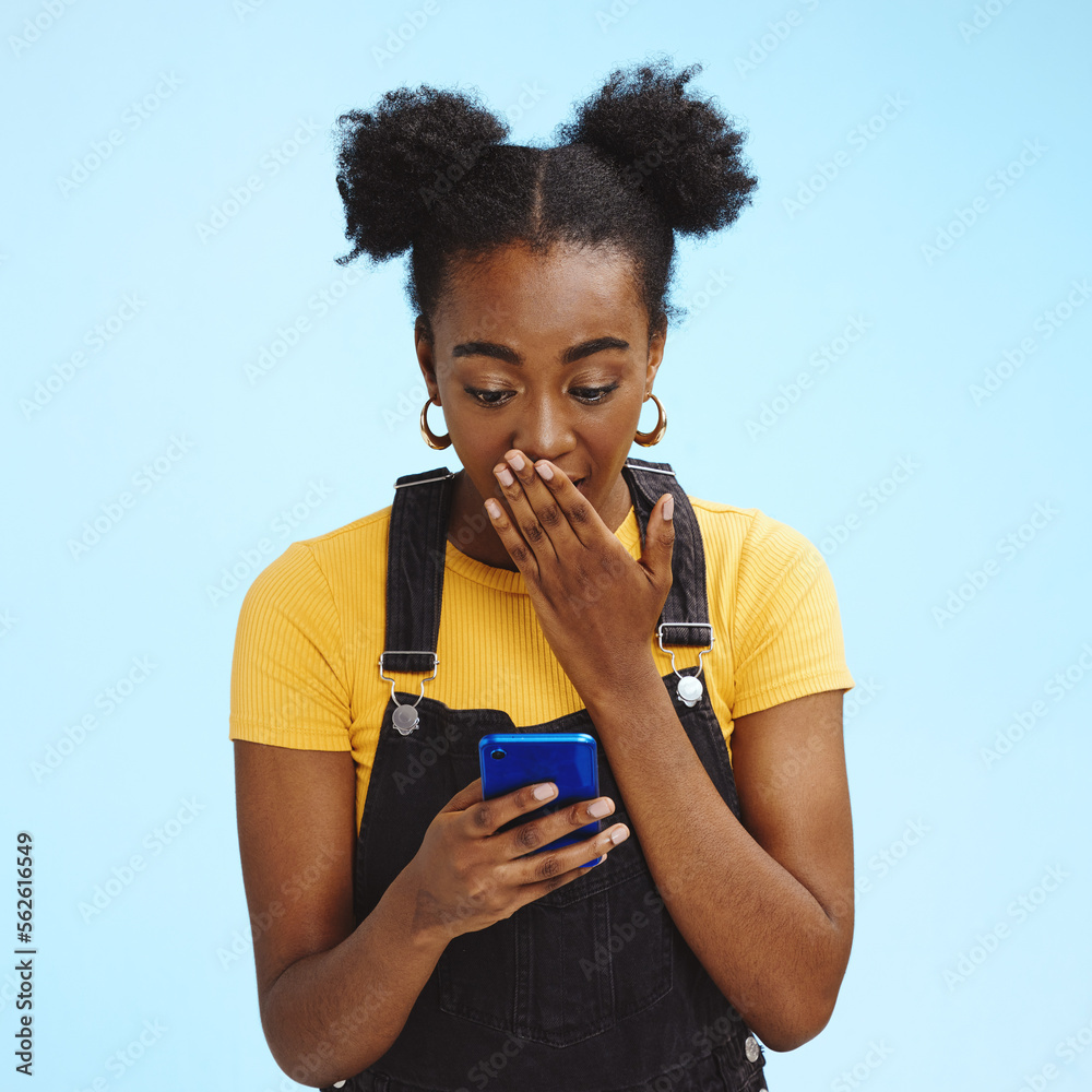 Wow, gossip and shocked black woman isolated on blue background for social media, fake news or post 