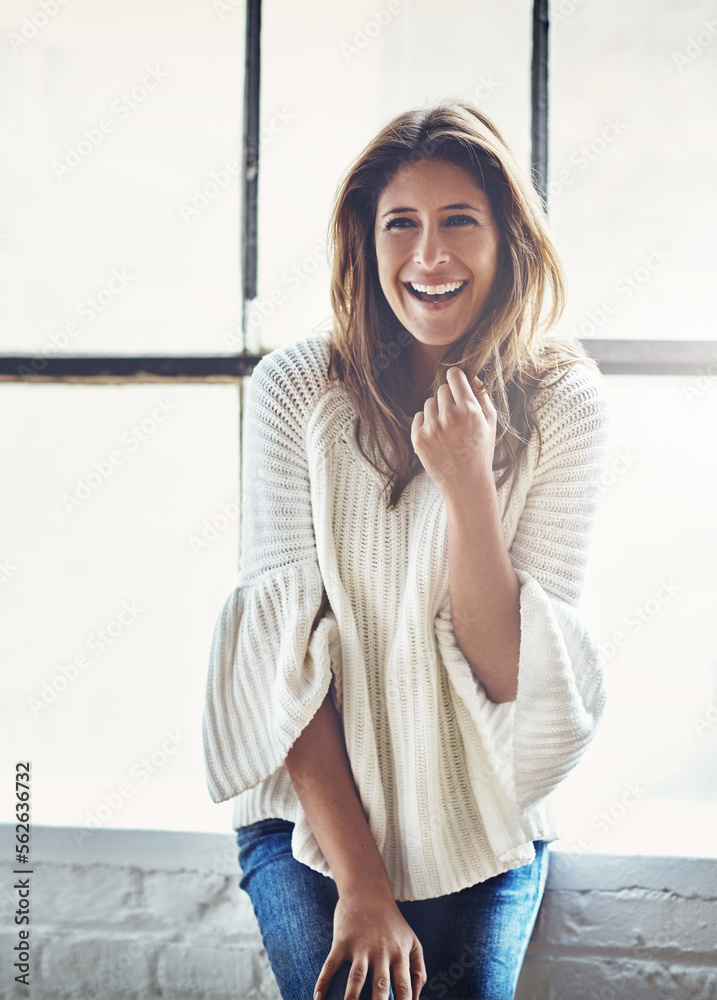 Portrait, happy and woman relax against a window in her home, content and cheerful on the weekend. F