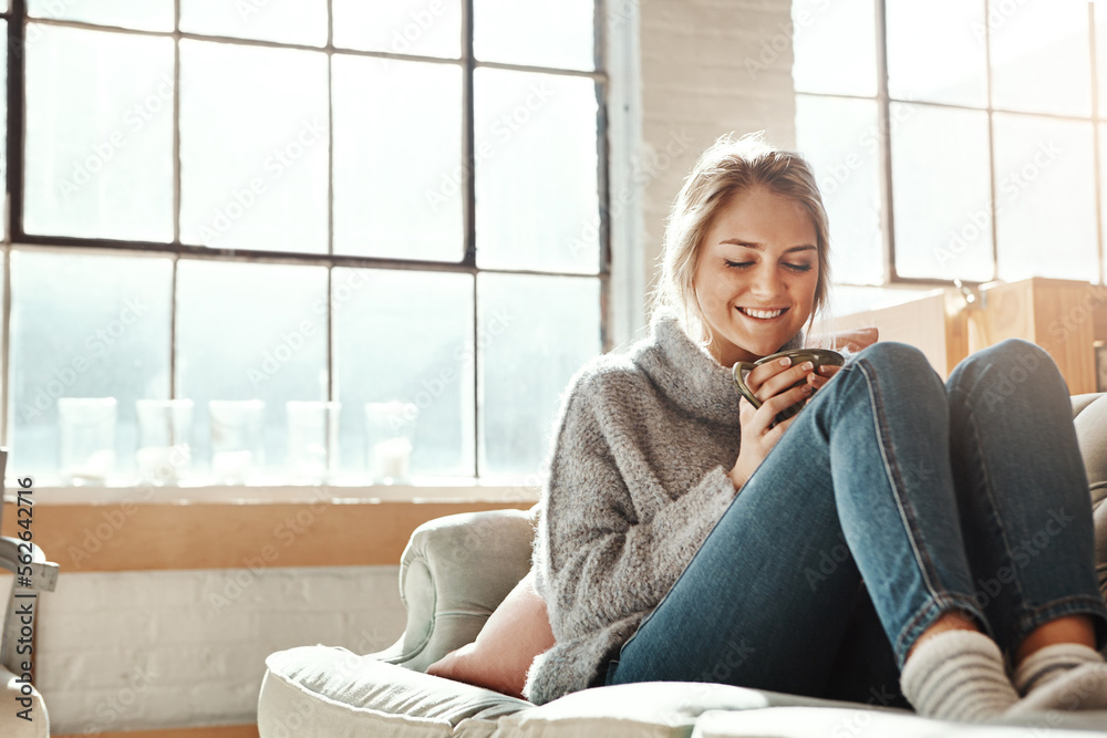 Woman on sofa, coffee and relax for happiness, break and on weekend for solitude, home and living ro