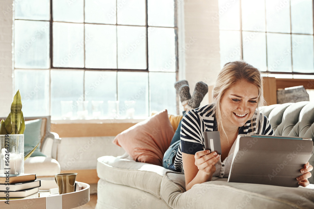 Tablet, ecommerce and payment of girl with credit card on sofa for banking details on card. Relaxed 