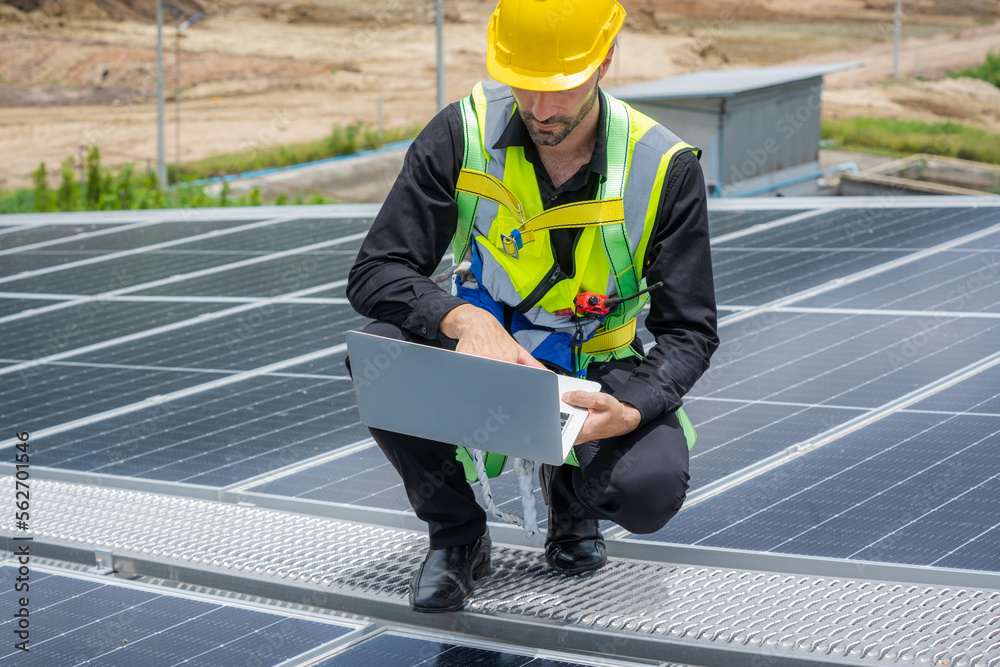 Engineer working on checking equipment in solar power plant,Solar power plant to innovation of green