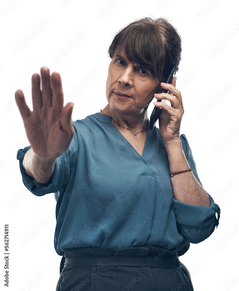 A mature woman gesturing to stop while talking on a cellphone Isolated on a PNG background.