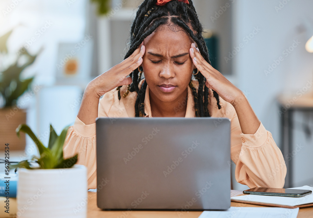 Black woman, headache and depression with laptop while tired in home office of studying or working. 