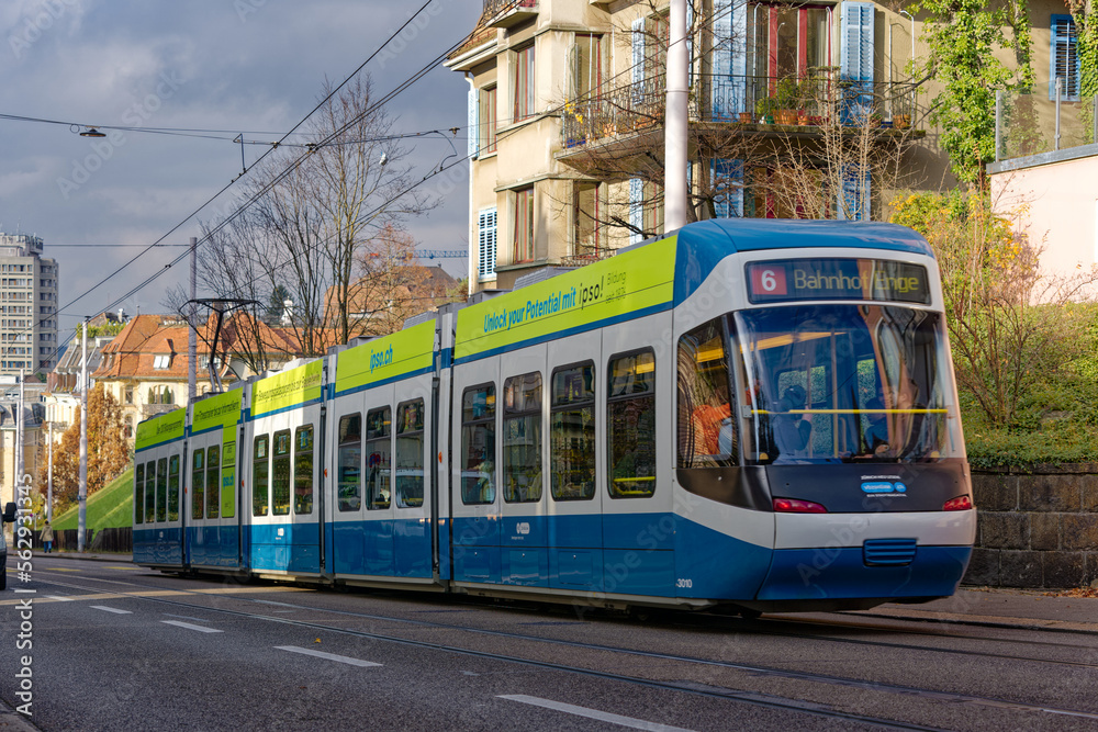 Tram line 6 destination Zoo at City of Zürich on a blue cloudy autumn day. Photo taken December 8th,