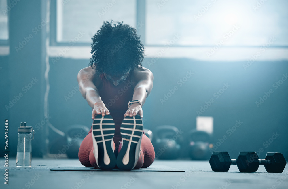 Fitness, mockup and a black woman stretching in the gym with dumbbells while holding her feet. Healt