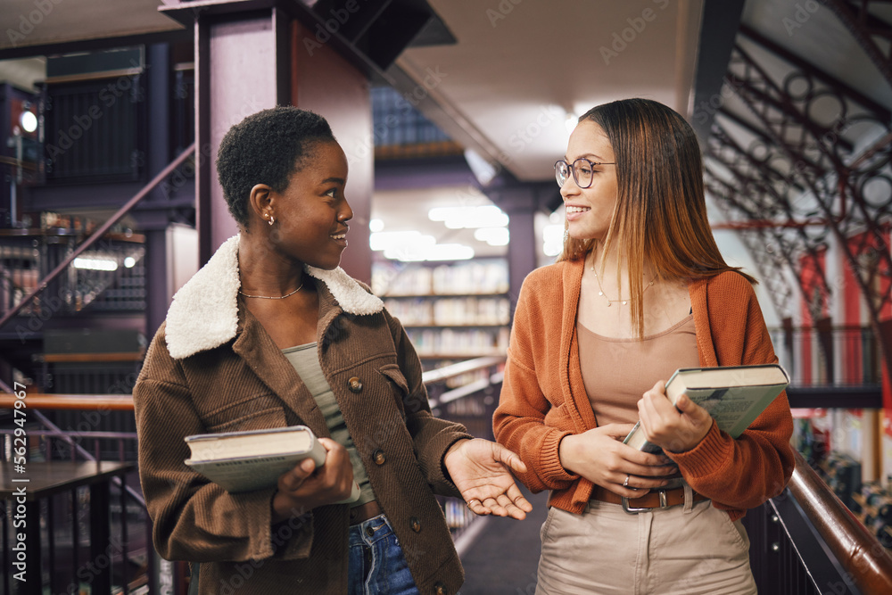 University students, library and talking about books, education and learning together at campus. Wom