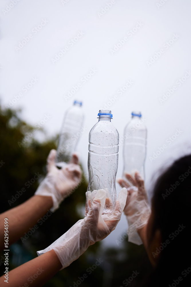 Bottle cleaning, sky and people hands recycle plastic garbage or pollution for volunteer environment