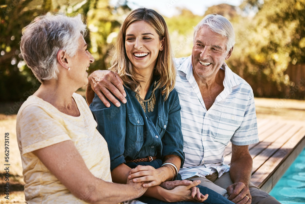 Family, senior parents and woman by pool holding with care, love and hug bonding outdoor. Smile, hap