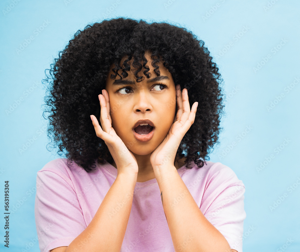 Shock, surprise face and black woman with isolated blue background in a studio. Wow, thinking and ha