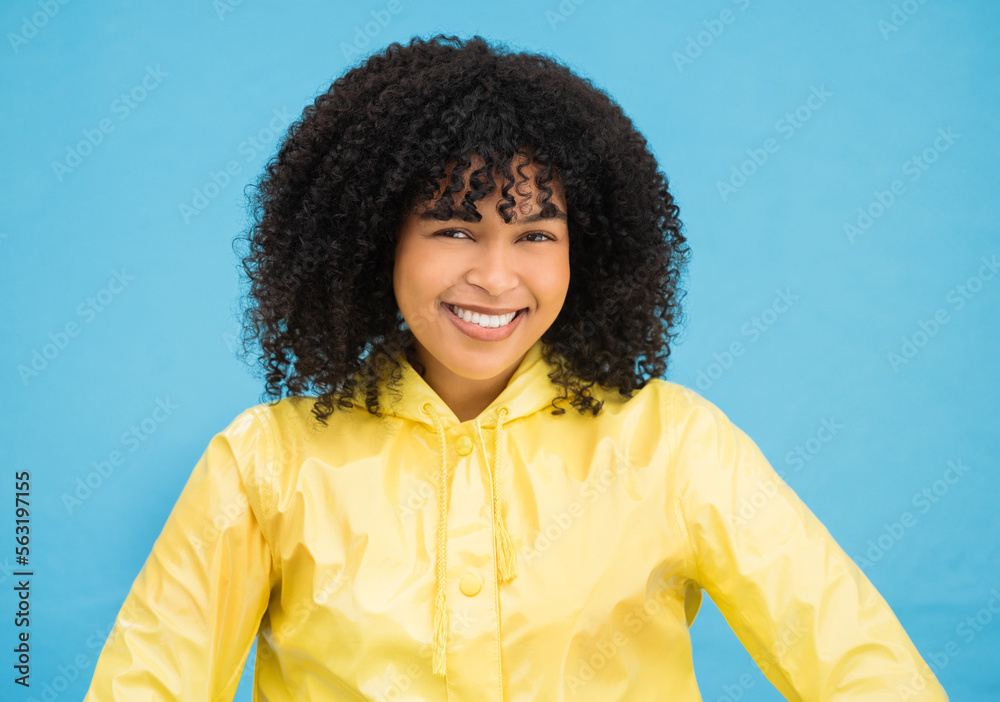 Black woman, smile and happy in portrait with fashion for winter, rain coat and beauty isolated on b