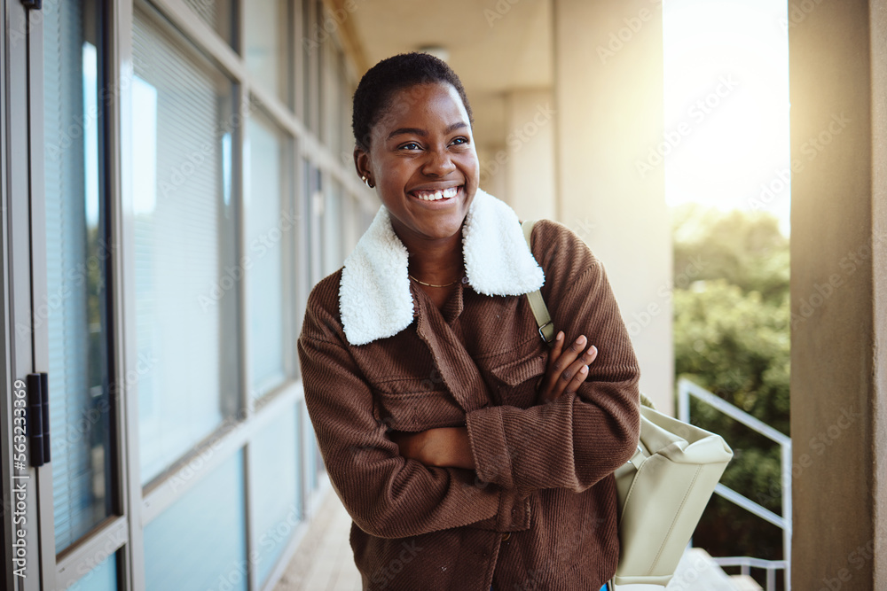 University, education student and black woman with arms crossed in campus ready for learning, studyi