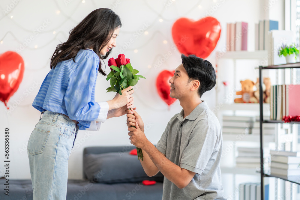 Asian couple Showing love surprise giving flowers or gifts to each other on important occasions such