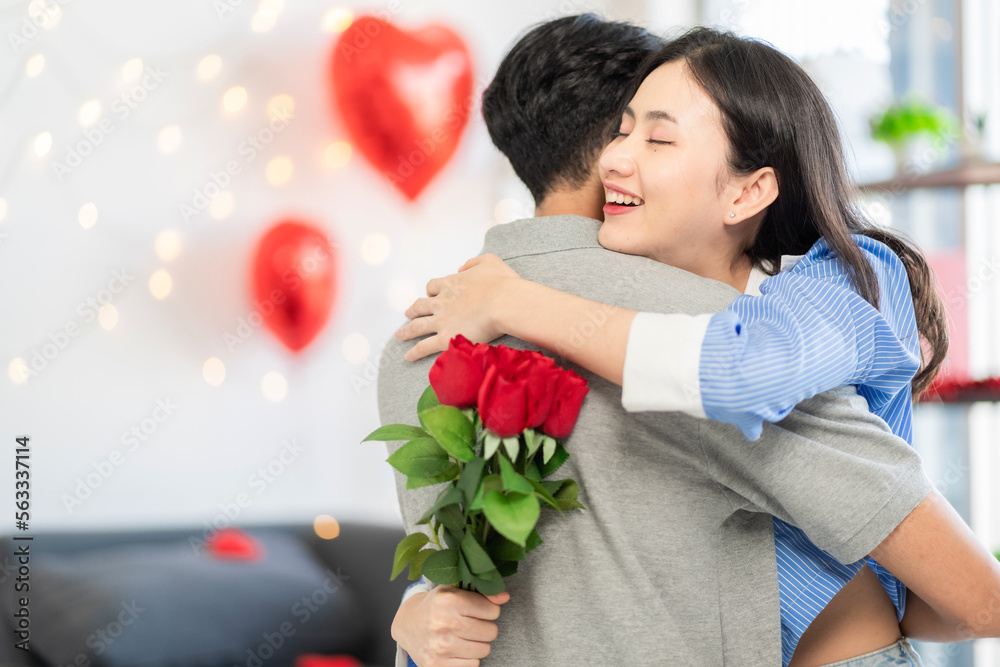 Asian couple Showing love surprise giving flowers or gifts to each other on important occasions such