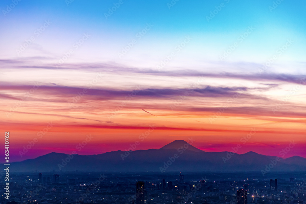 Aerial view of the skyline at sunset with Mount Fuji in Tokyo, Japan