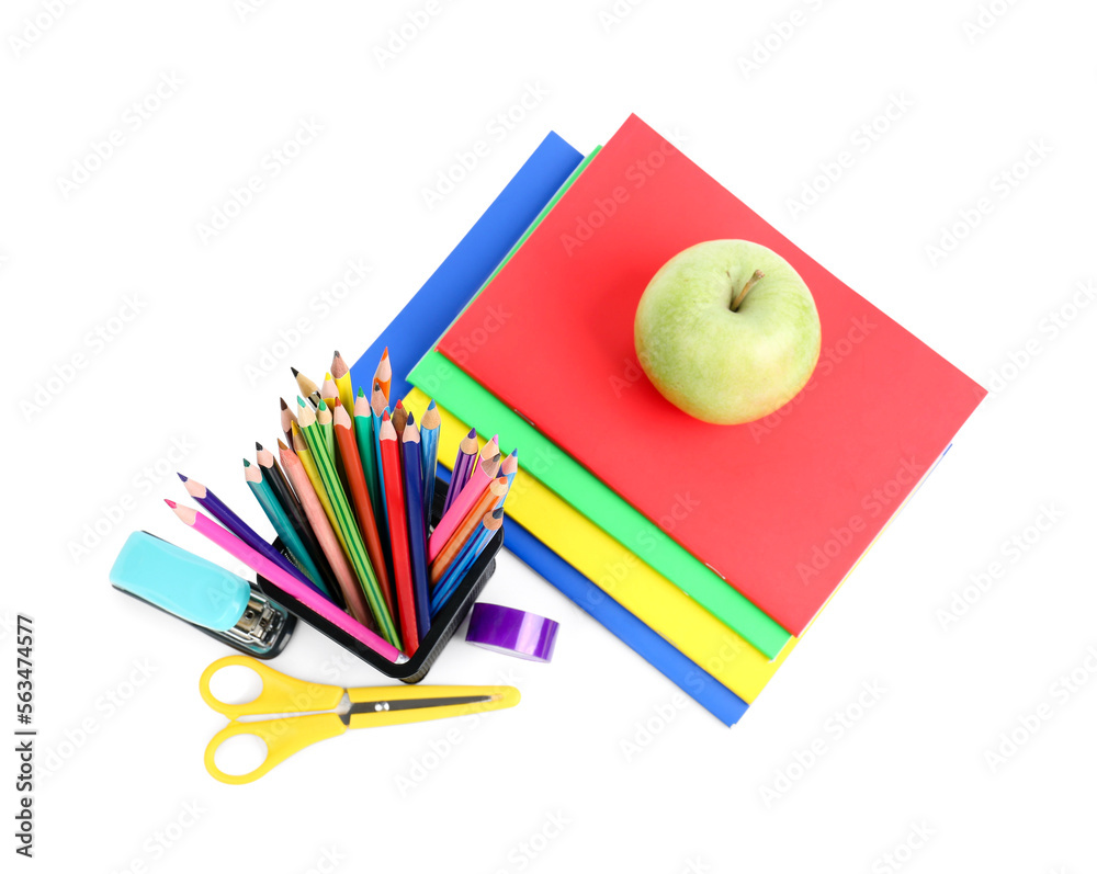 Green apple with notebooks, pencils holder and school stationery on white background